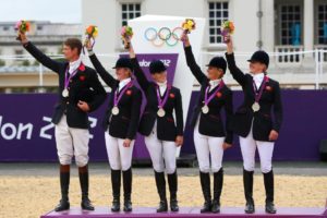 LONDON, ENGLAND - JULY 31:  The Great Britain team celebrate on the podium after winning the Silver medal in the Eventing Team Jumping Final Equestrian event on Day 4 of the London 2012 Olympic Games at Greenwich Park on July 31, 2012 in London, England.  (Photo by Alex Livesey/Getty Images)