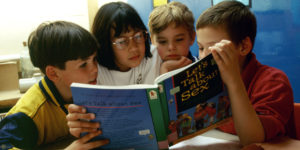 Sex education in primary school. 8 & 9 year olds reading Let's Talk About Sex book, London Borough of Greenwich UK. (Photo by: Photofusion/UIG via Getty Images)